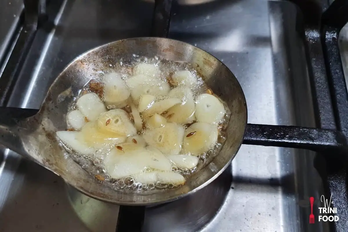 frying garlic and whole geera in oil