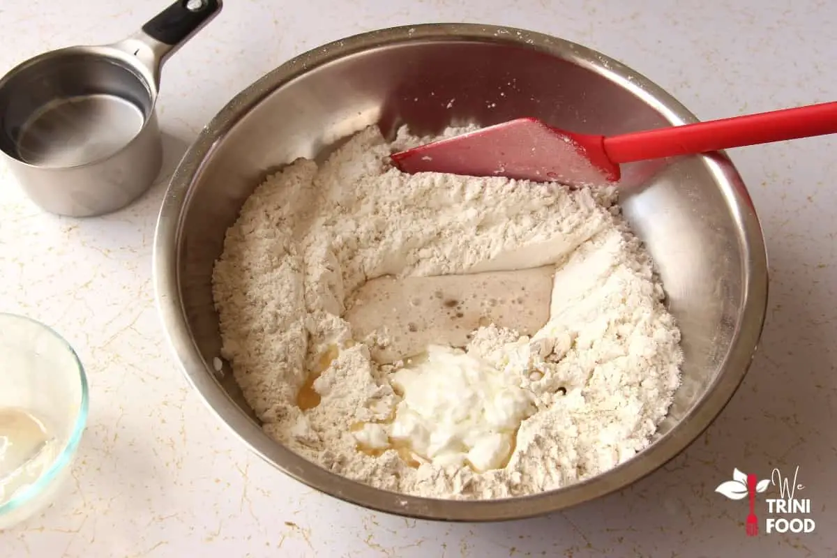 add wet ingredients for garlic naan
