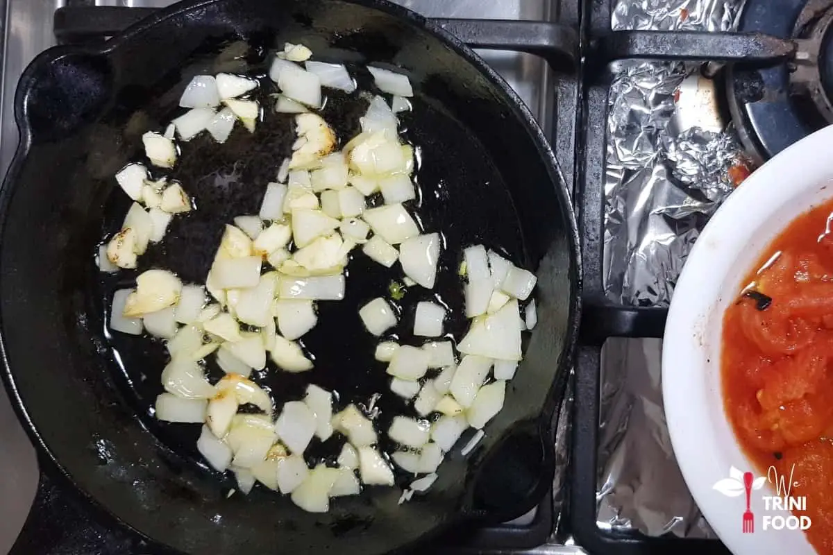 frying the onions before making tomato choka