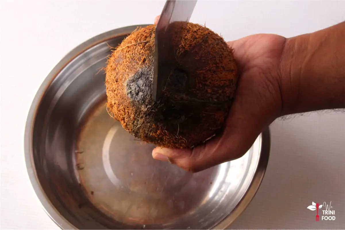 cracking open coconut for bake