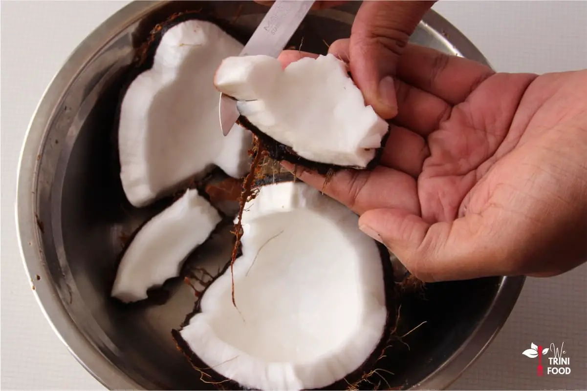 pry coconut meat out with knife