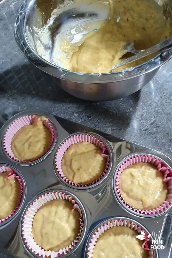 add banana bread muffins batter to muffin tray