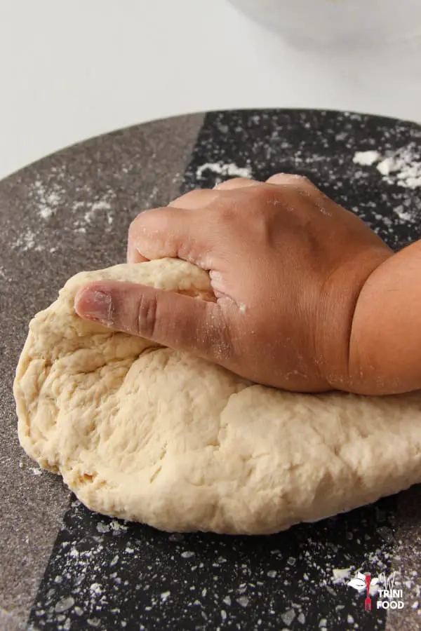 knead white bread dough