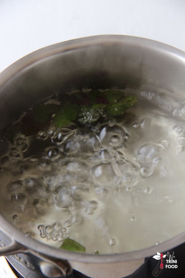 brewing tulsi leaves