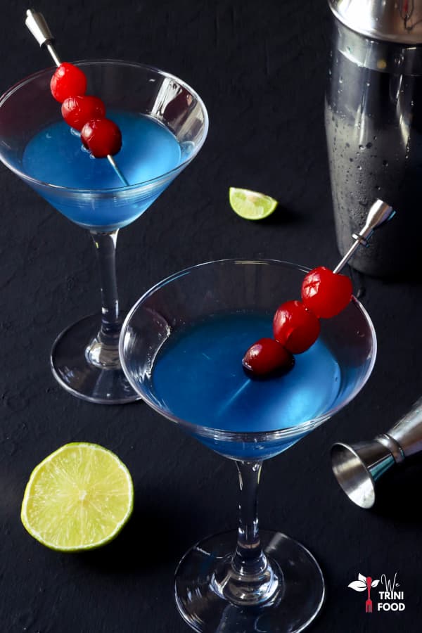 blue kamikaze garnished with cherries