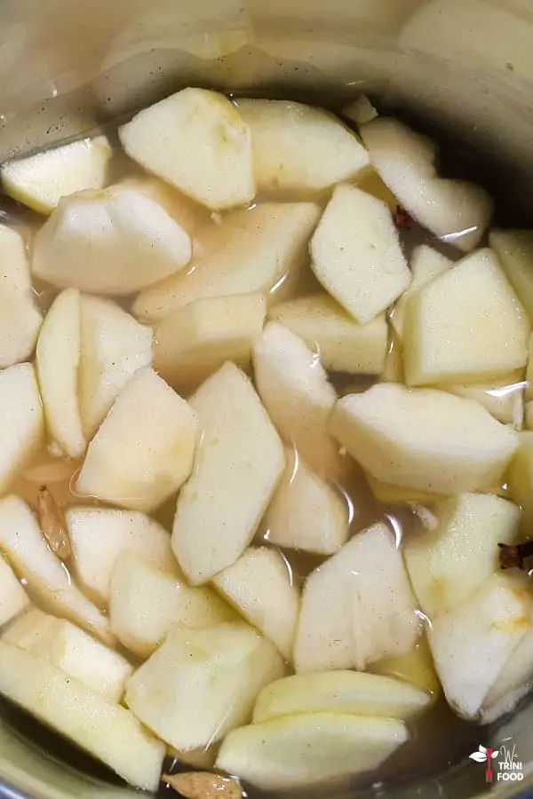 cooking stewed apples in saucepan