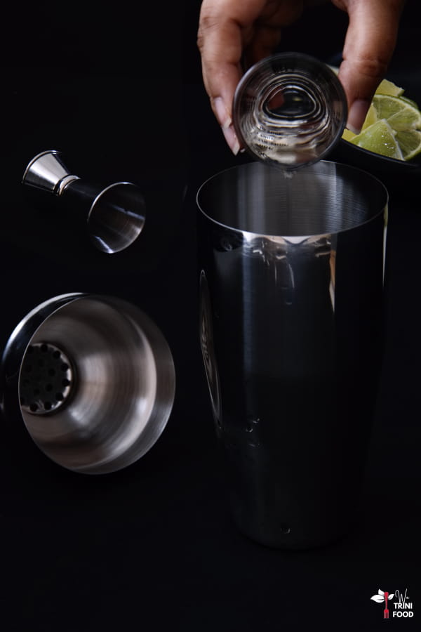 pouring ingredients for a daiquiri