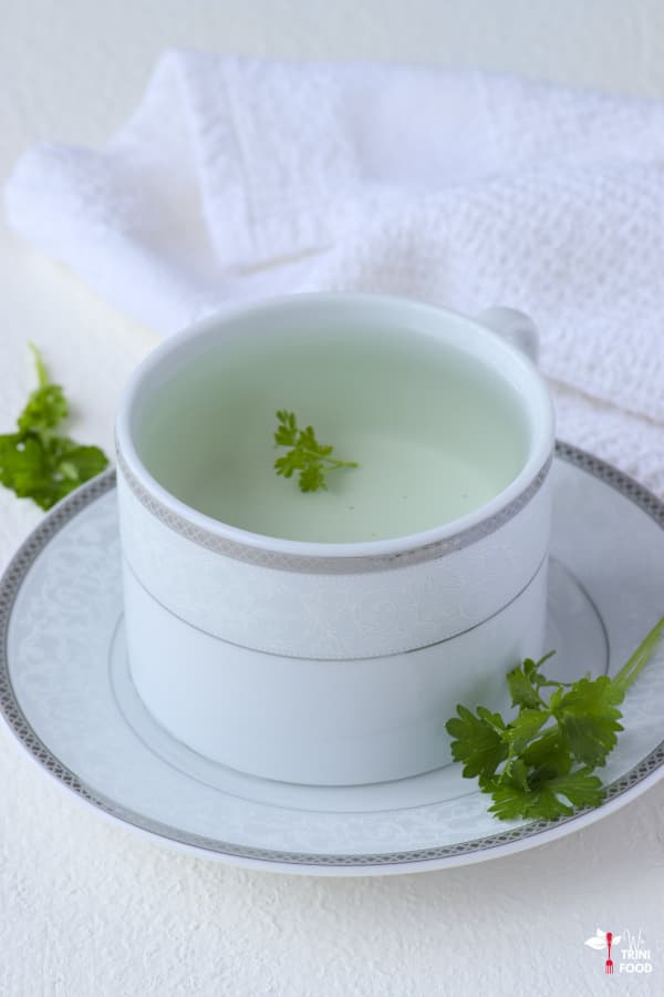 parsley tea in teacup and saucer