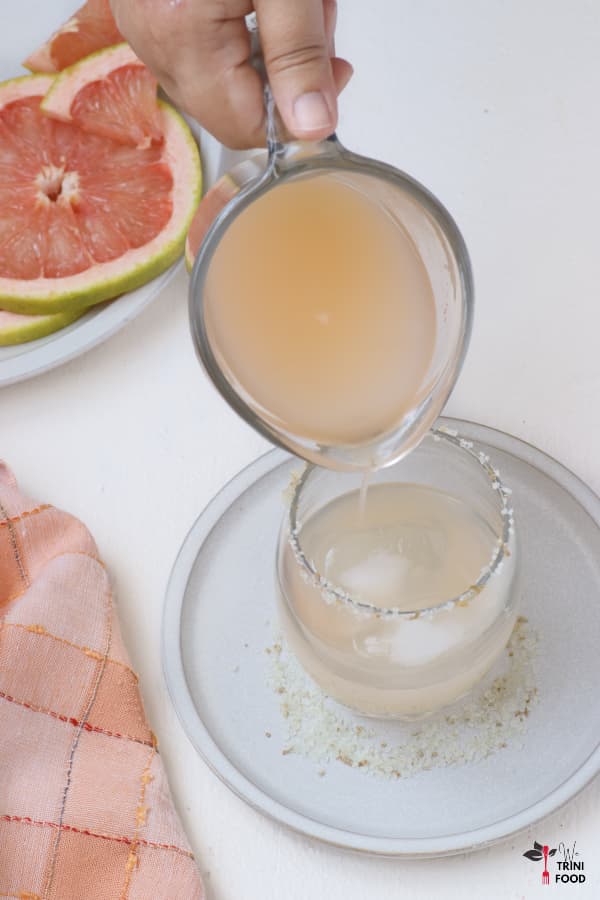pouring grapefruit juice for salty dog
