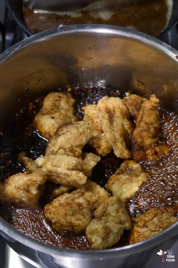 add fried chicken to korean spicy and sweet sauce