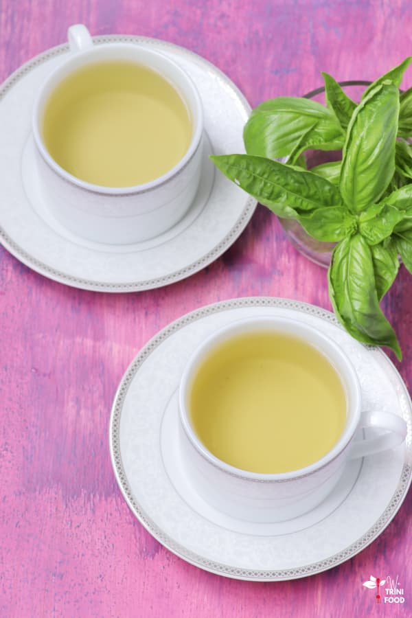 basil tea in teacups with saucers