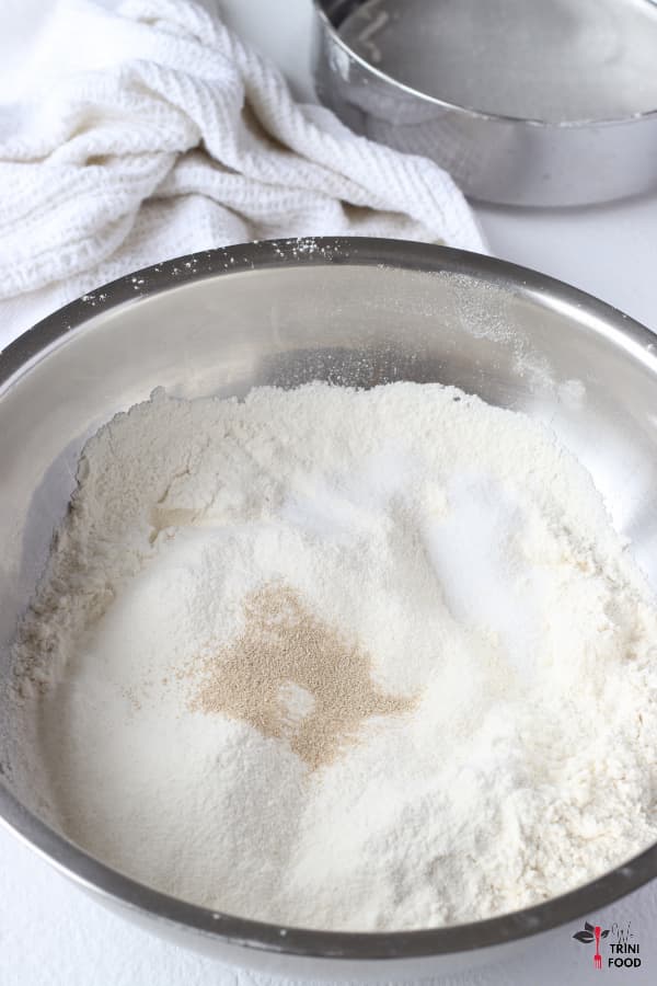 dry ingredients with sieve for no knead bread