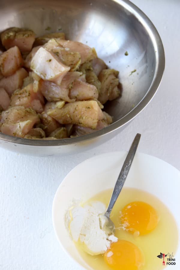 eggs, corn starch and raw chicken cut into pieces