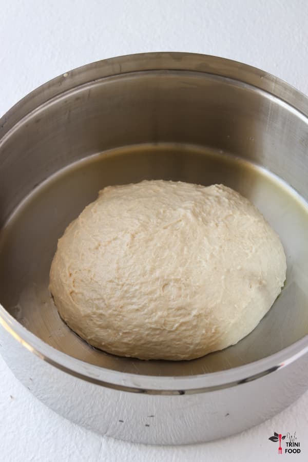 olive oil and dough in pan