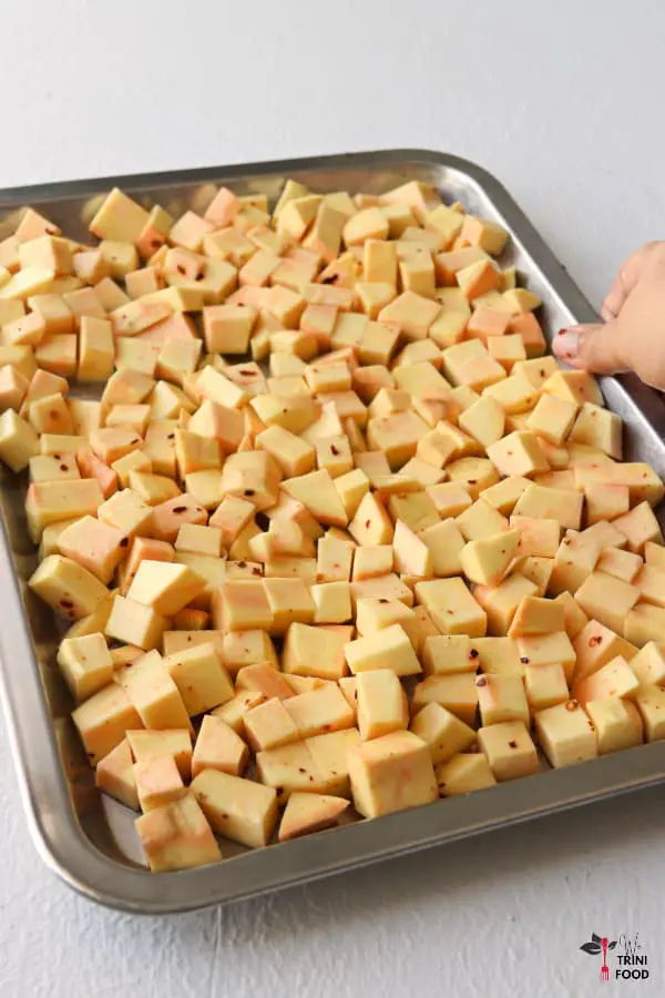 seasoned sweet potatoes on tray