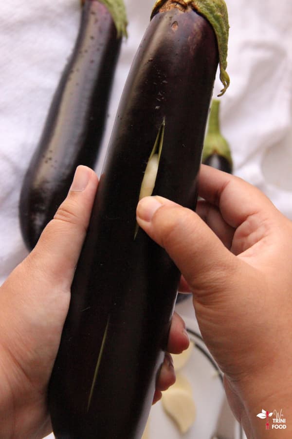 add garlic to slits in eggplant