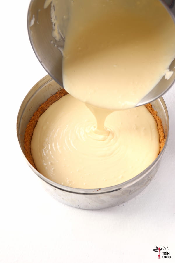 pour passion fruit cheesecake batter onto crust