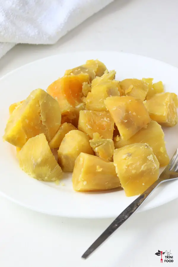 boiled sweet potatoes with fork on plate