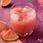 guava juice in glass with fruit