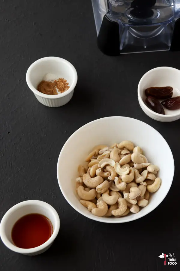 ingredients for cashew milk laid out in small bowls