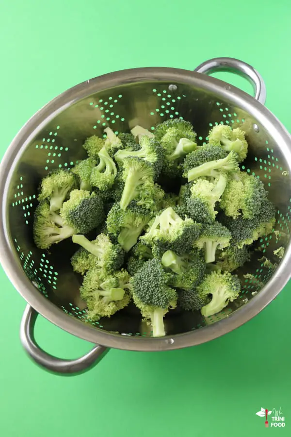washed broccoli florets in a colander