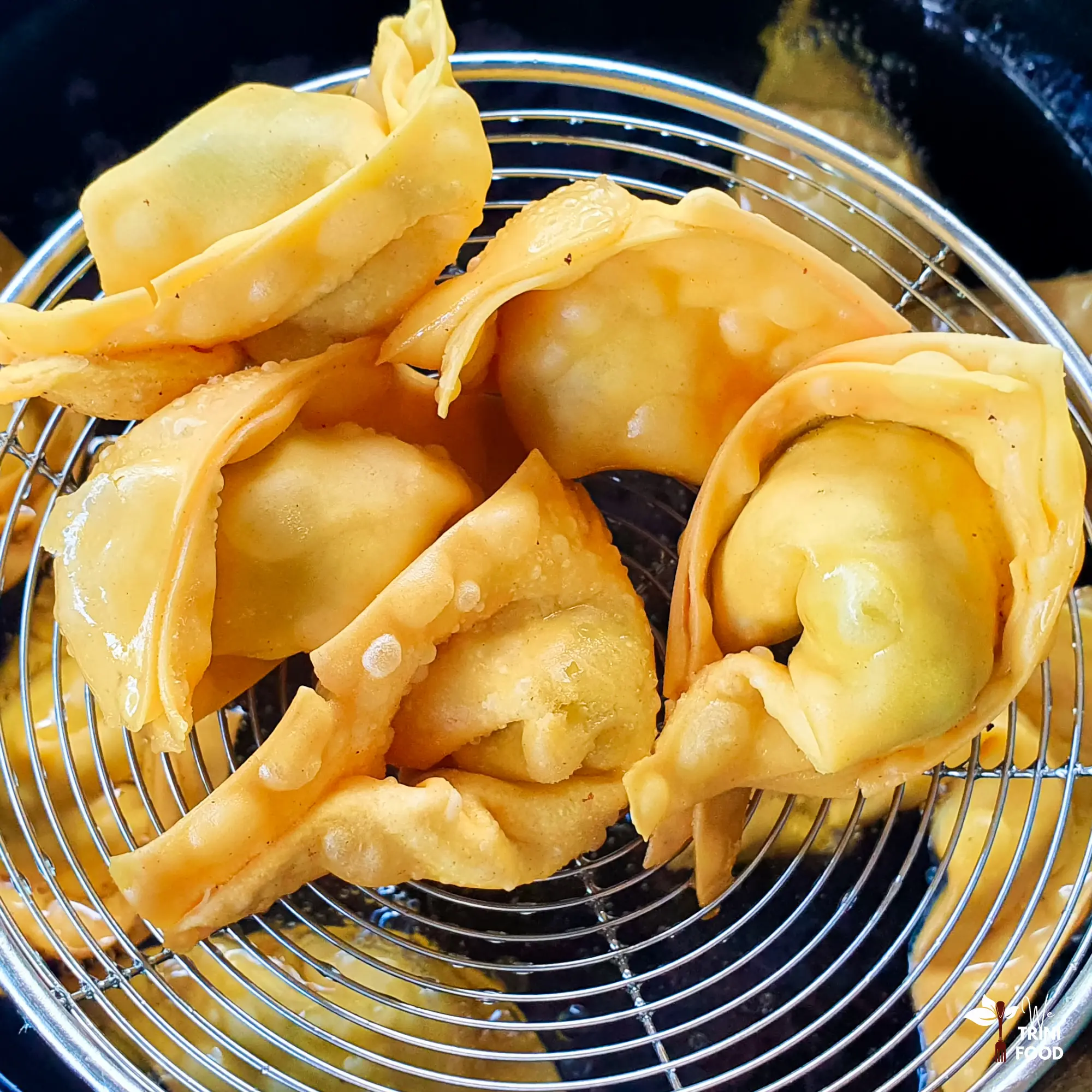 fried chicken wontons fresh out of fryer