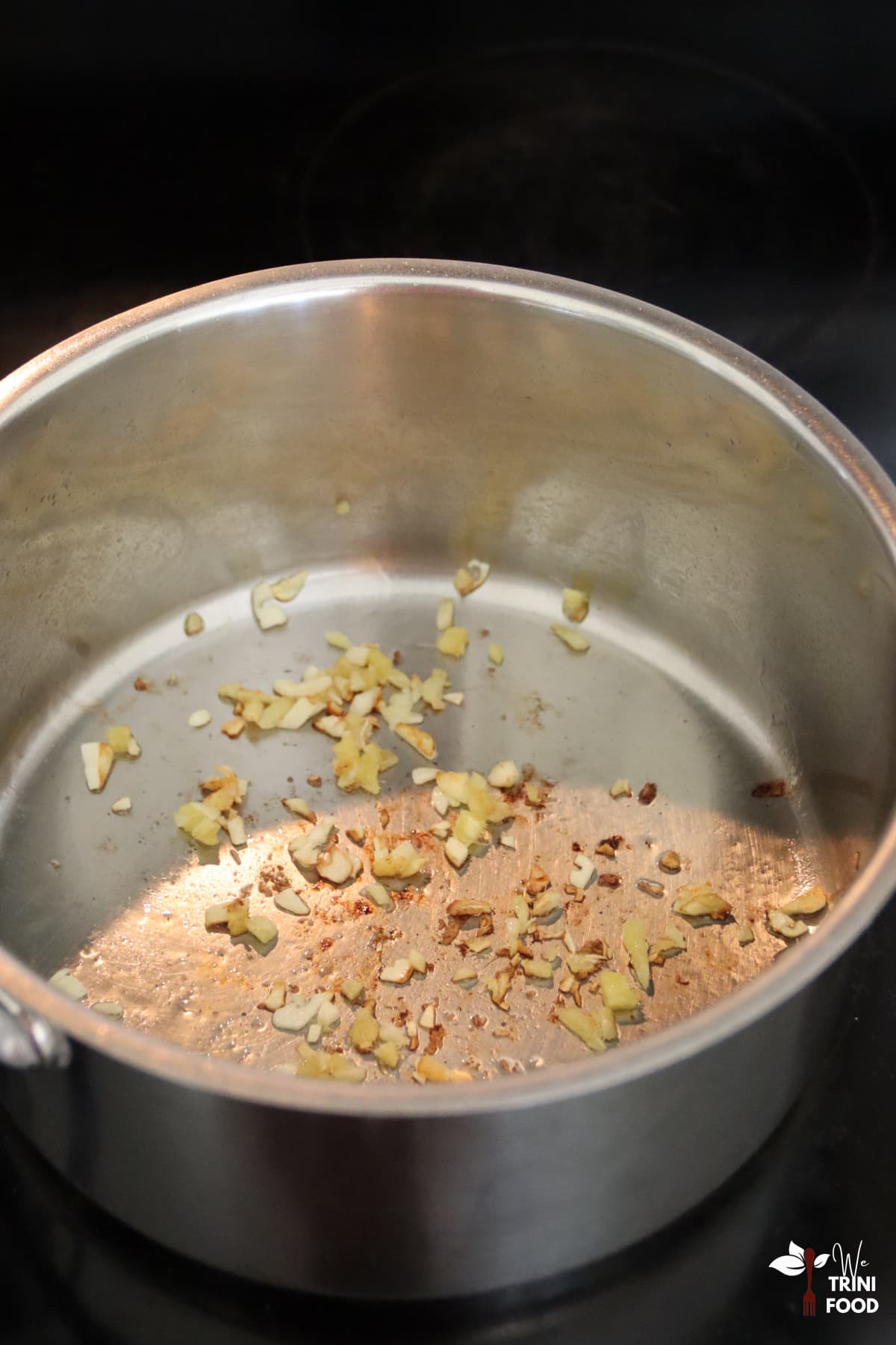 saute garlic and ginger in pan to make butternut squash soup