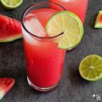 watermelon juice featured image angled view with ingredients on the side