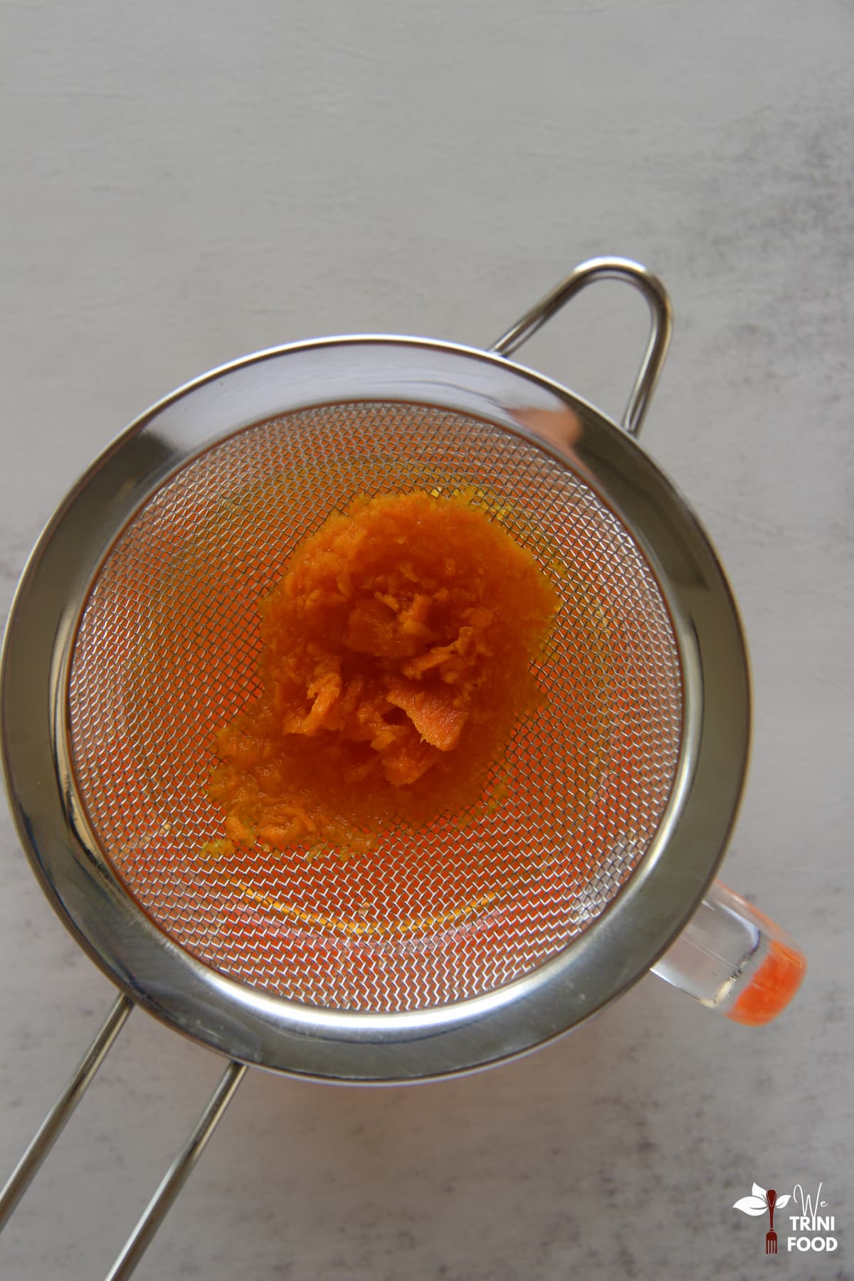 straining turmeric tea