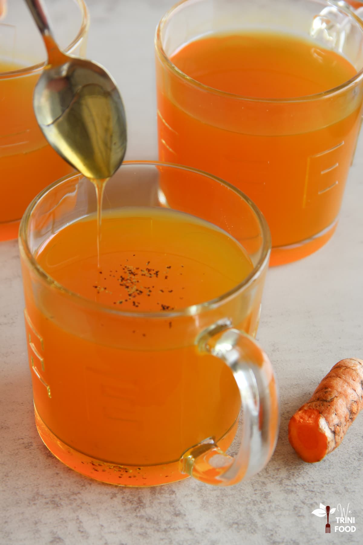 adding honey to turmeric tea