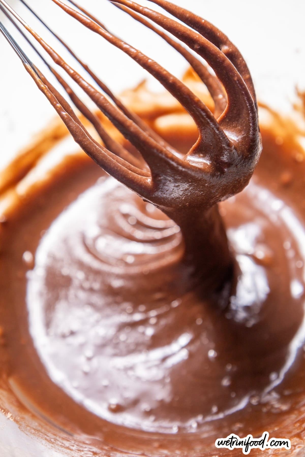 combined brownie batter with whisk