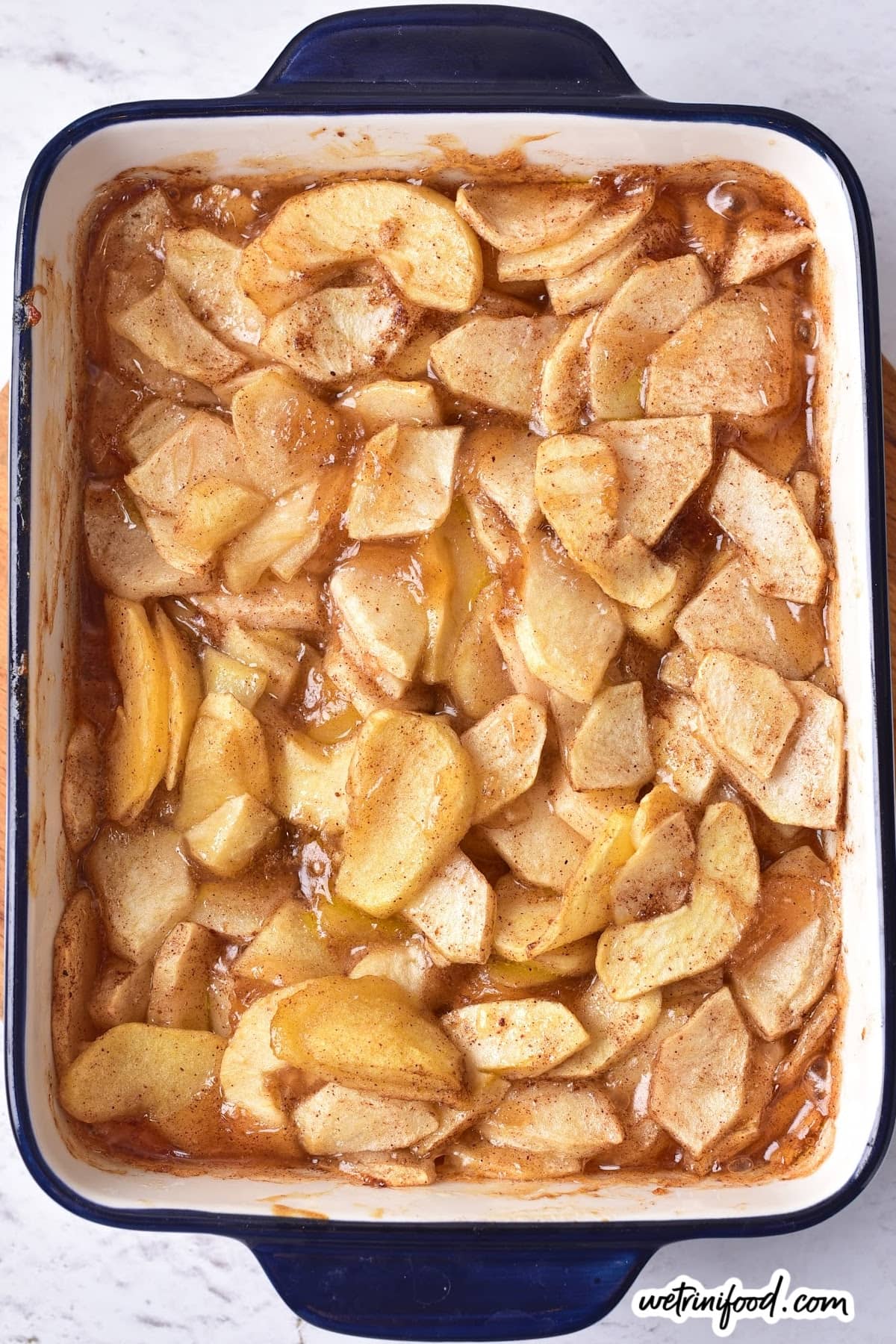 baked apples pieces in baking dish out of the oven
