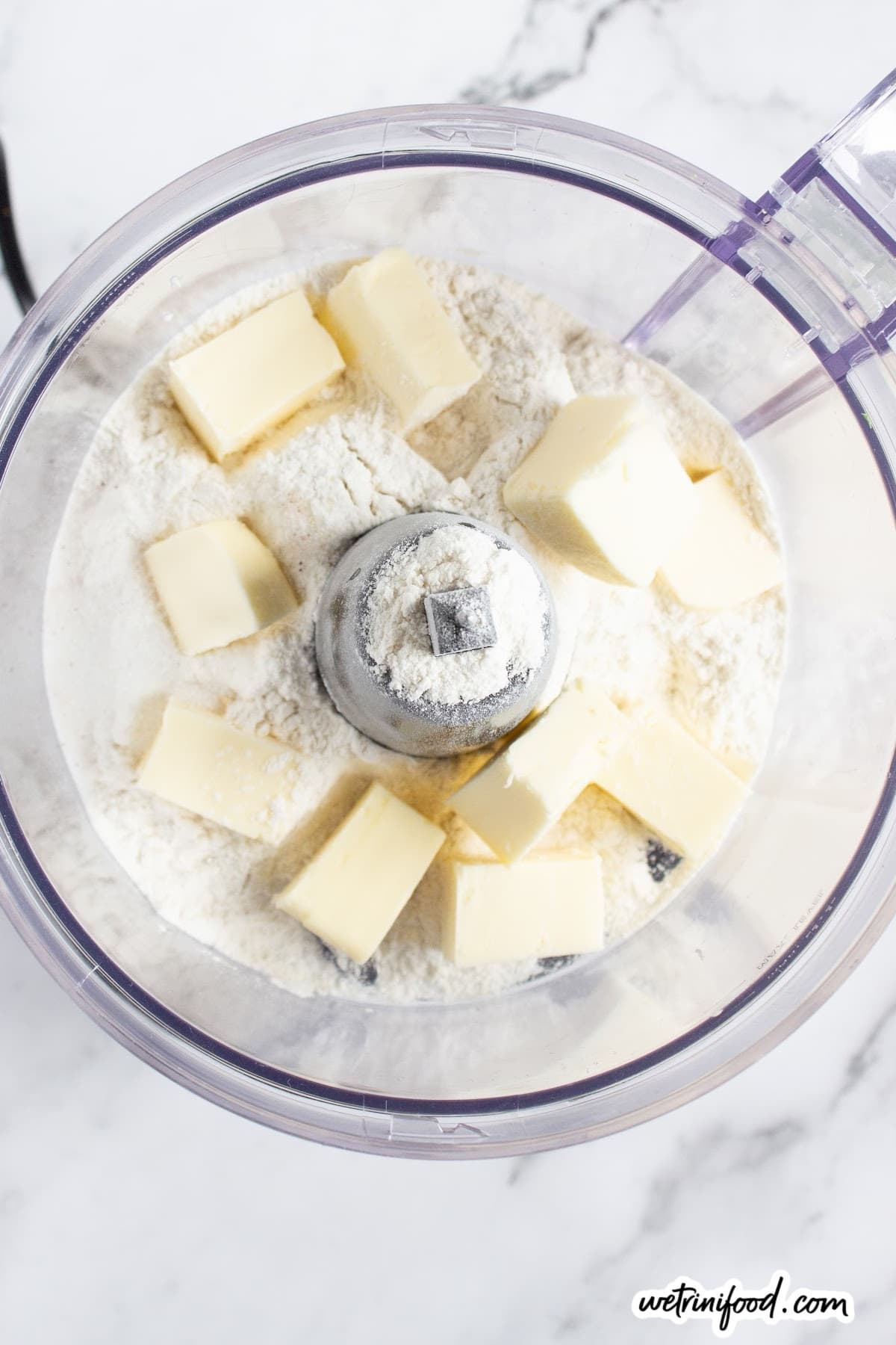 cubes of butter and flour in food processor