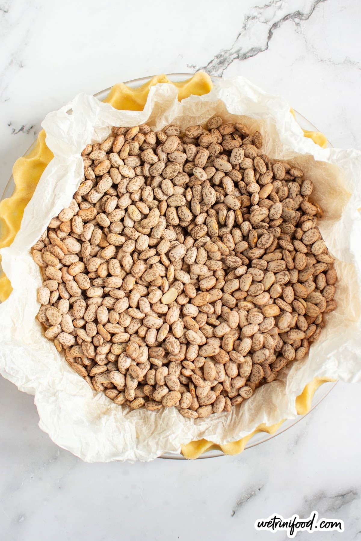 prepped pie crust for blind baking