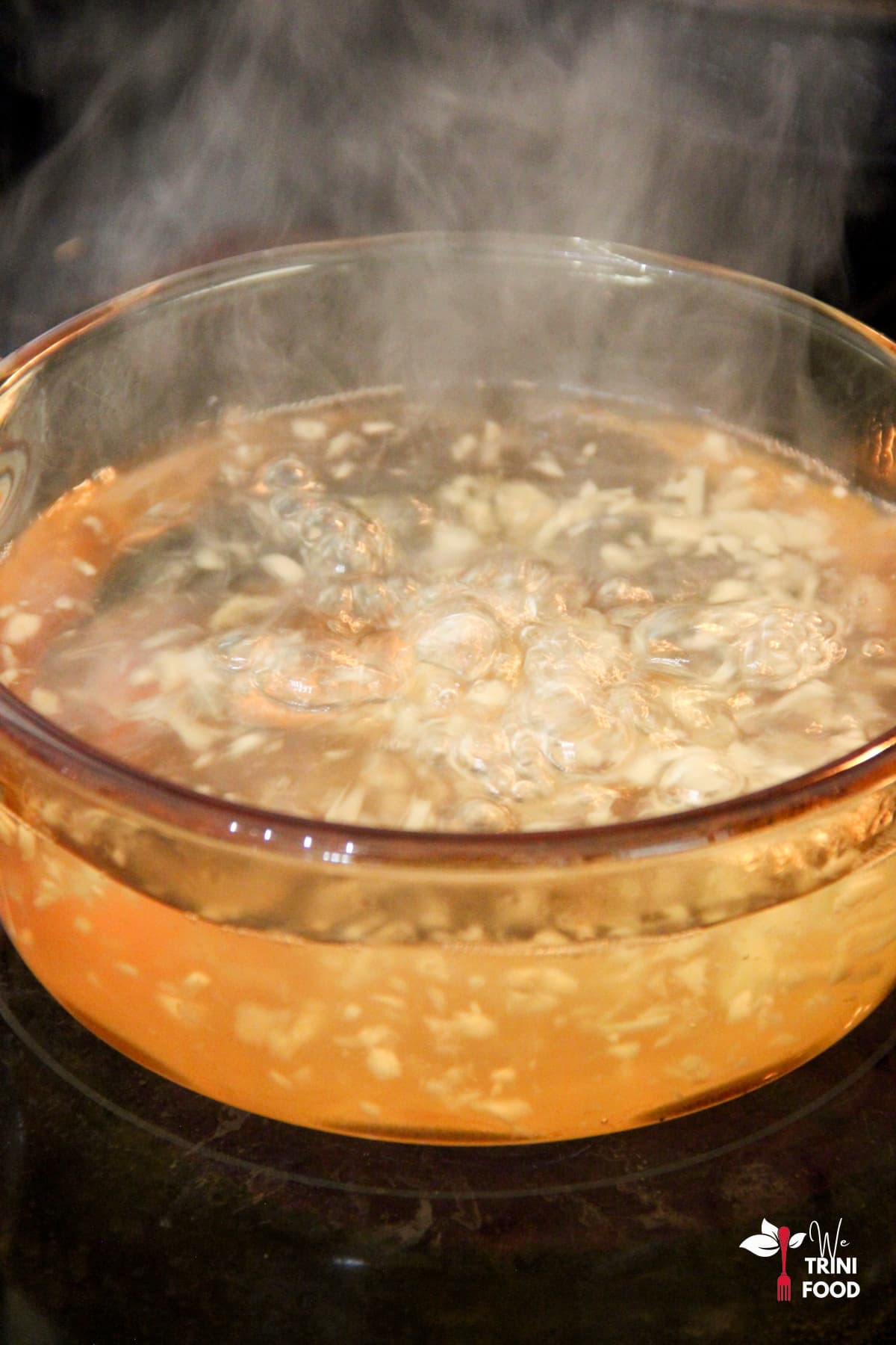 boiling ginger and water for lemon and ginger tea