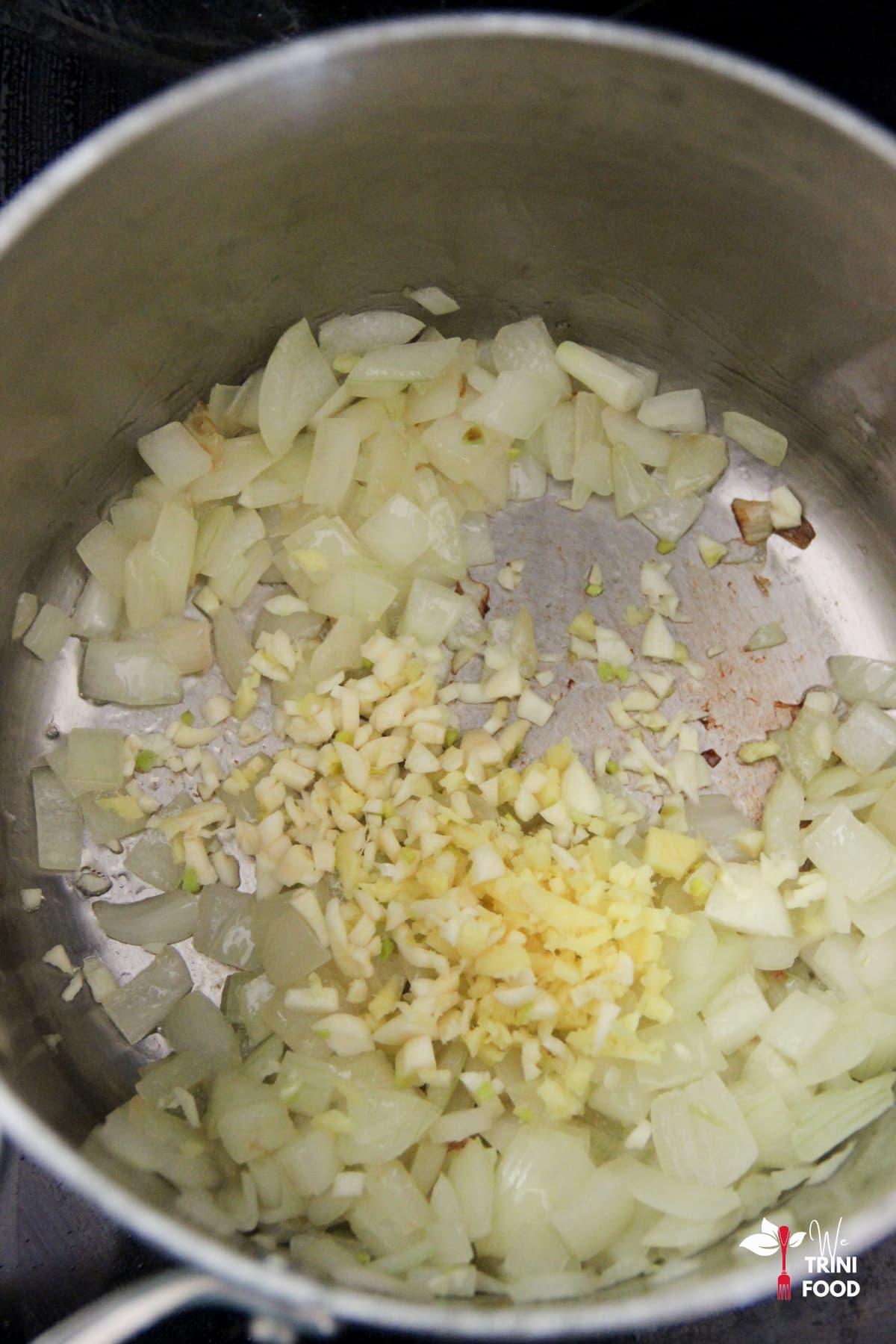 Adding garlic and ginger for carrot ginger soup