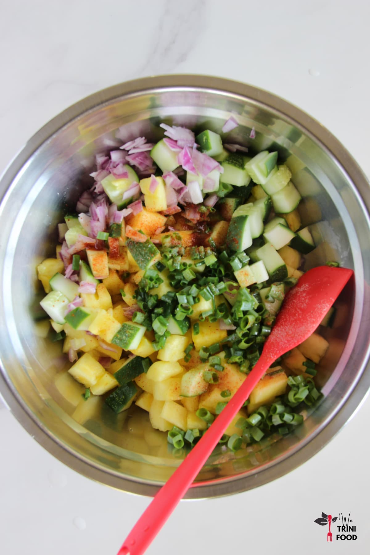 Mixing Pineapple and Cucumber Salad